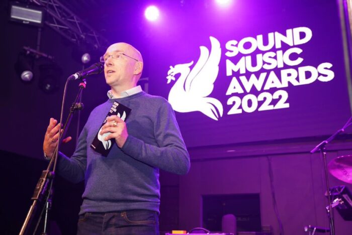 Liverpool Acoustic's Graham Holland accepts the award for Promoter of the Year at the Sound Music Awards 2022